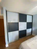 Checker board design in white glass and alby blue panel with champagne frames, fitted in Eaglescliffe